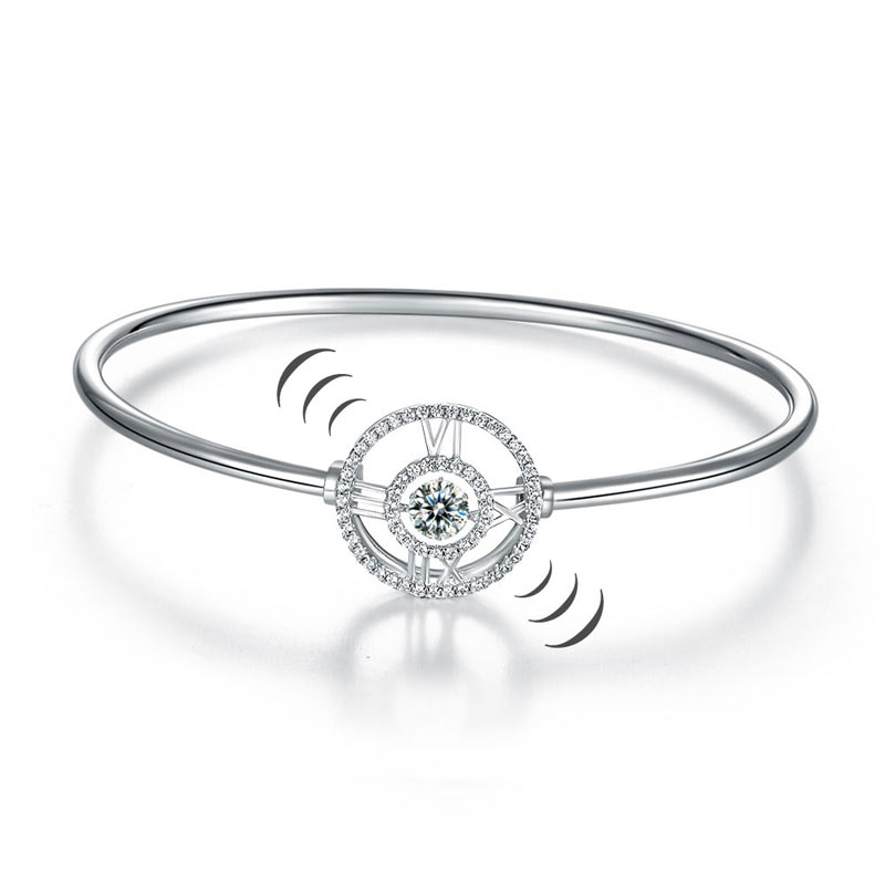 Pulsera brazalete con piedra danzante y reloj con números romanos