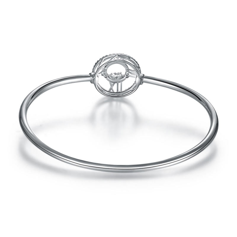 Pulsera brazalete con piedra danzante y reloj con números romanos