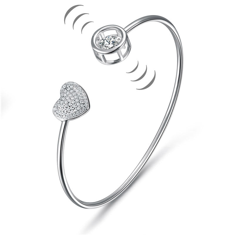 Pulsera con corazón pavé y piedras danzantes