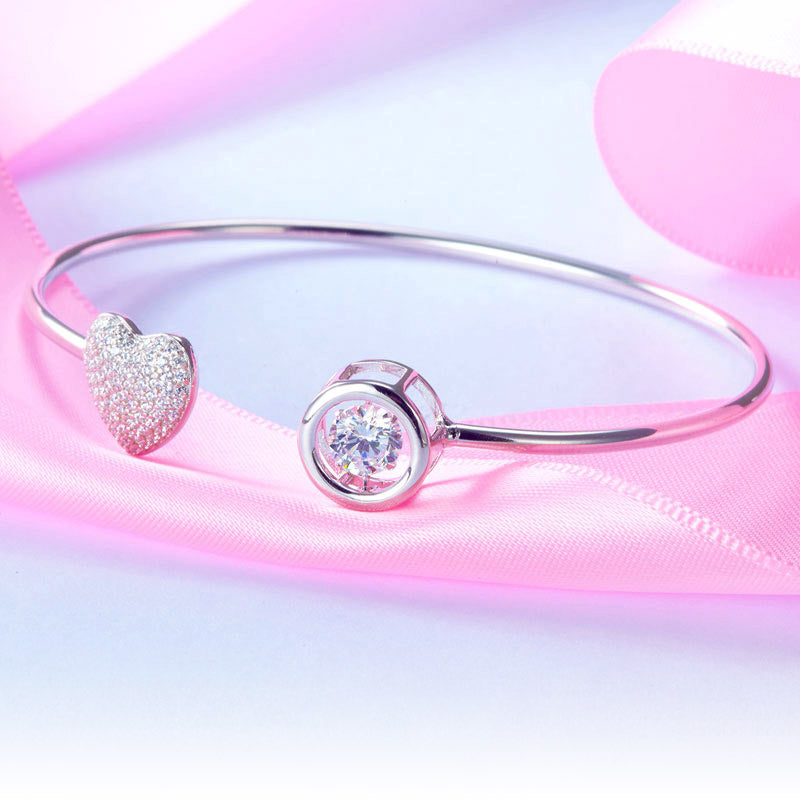 Pulsera con corazón pavé y piedras danzantes