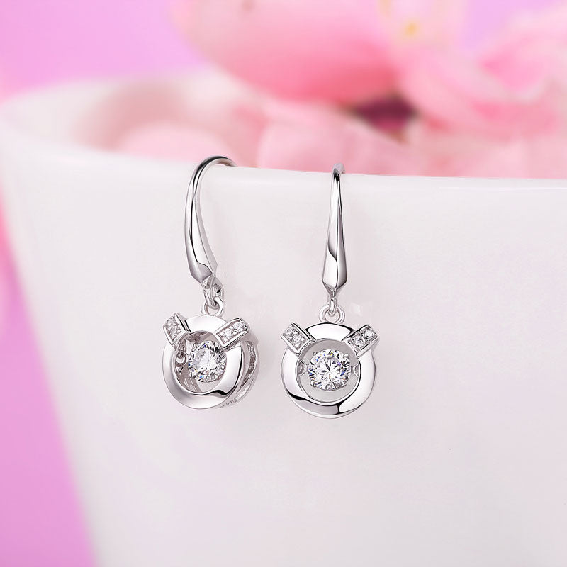 Boucles d'oreilles pendantes en pierre ronde dansante