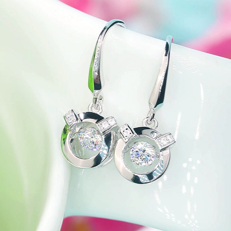 Boucles d'oreilles pendantes en pierre ronde dansante