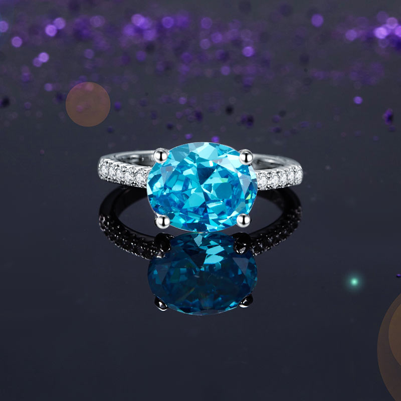 Anillo de diamantes simulados azul aguamarina de talla ovalada de 4 quilates en plata de ley