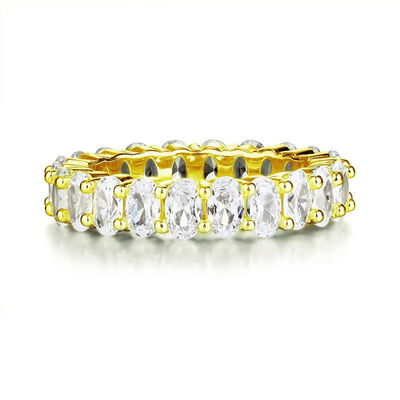 Anillo de eternidad con diamantes simulados de talla ovalada en oro amarillo y plata de ley.