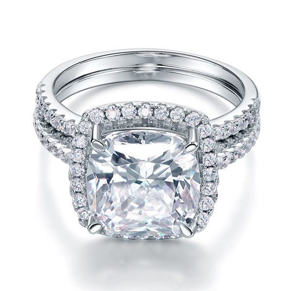 Conjunto nupcial de 5 quilates con halo de diamantes simulados de talla cojín en plata de ley