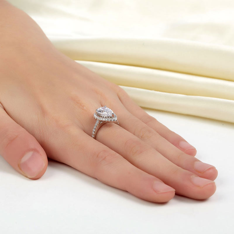 2 CT. Pear Cut Simulated Diamond Halo Ring in Rose Gold Plated Sterling Silver