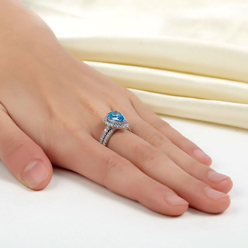 2 CT. Pear Cut Aqua Blue Simulated Diamond Halo Bridal Set in Sterling Silver