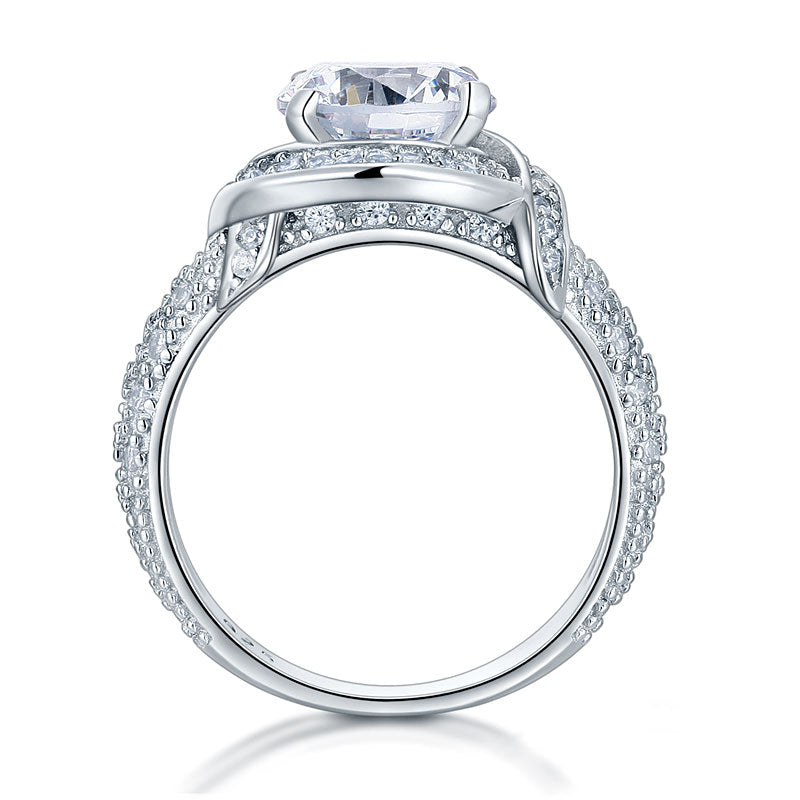 Anillo de estilo vintage con halo redondo y giro de 2 quilates en plata de ley
