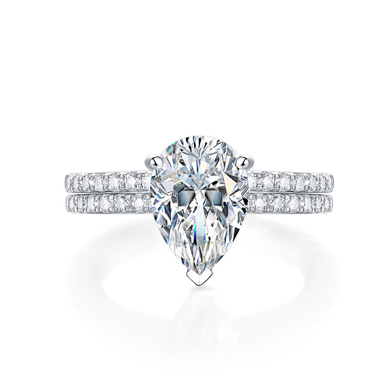 Conjunto nupcial de moissanita de 2 quilates con corte de pera y diamantes en plata de ley.