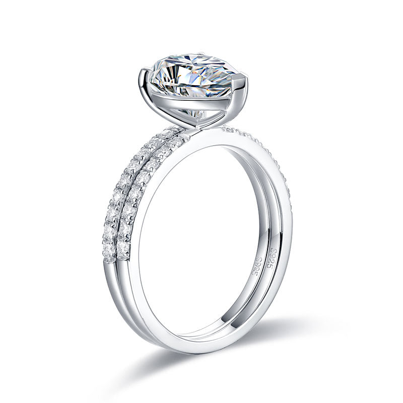 Conjunto nupcial de moissanita de 2 quilates con corte de pera y diamantes en plata de ley.
