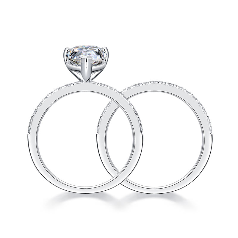 Conjunto nupcial de moissanita de 2 quilates con corte de pera y diamantes en plata de ley.
