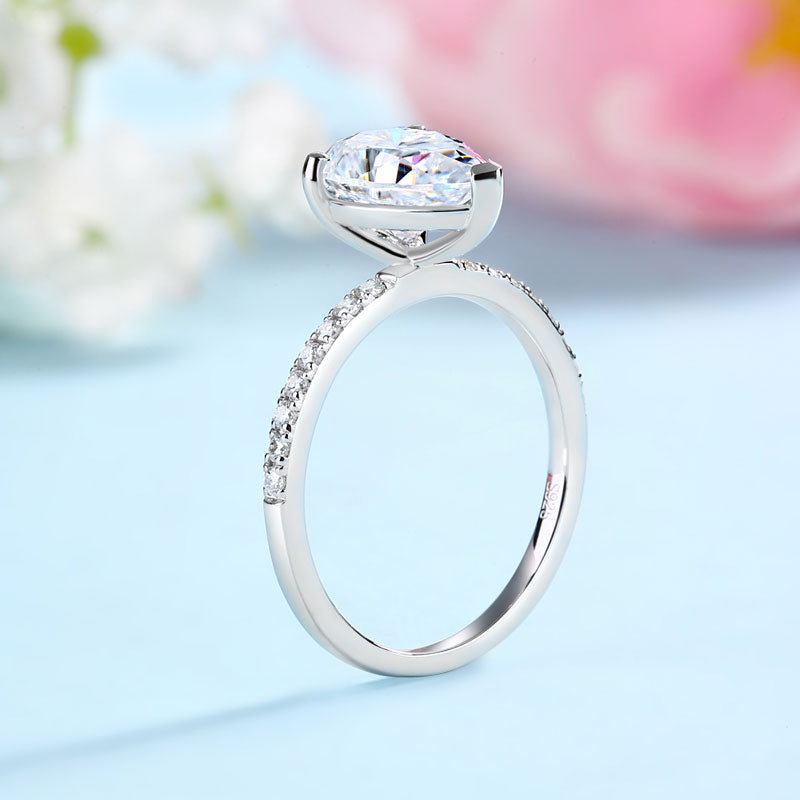 Conjunto nupcial de moissanita de 2 quilates con corte de pera y diamantes en plata de ley.