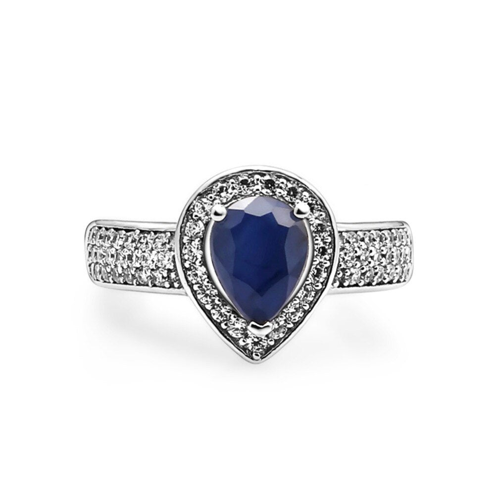 Conjunto de joyas GRACE con zafiro azul talla pera y halo en plata de ley