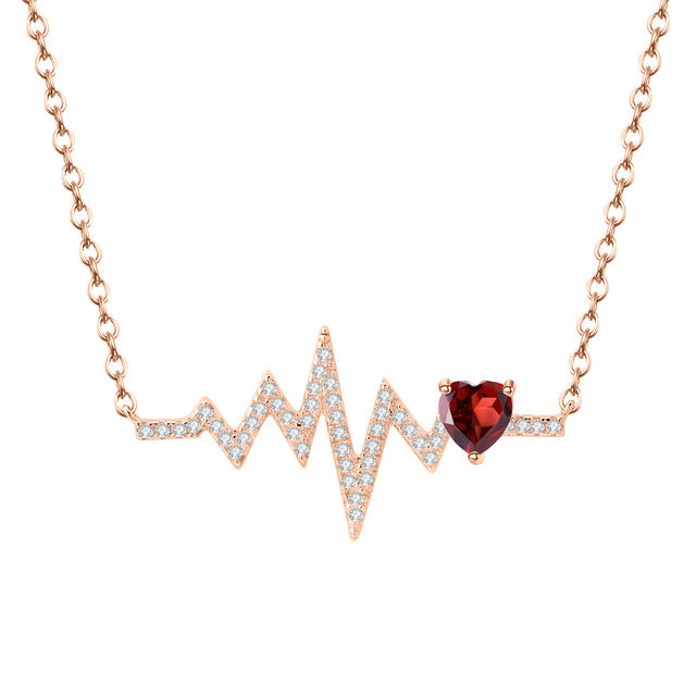 Collar GRACE con corazón de granate rojo y pulso en plata de ley bañada en oro