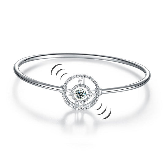 Pulsera brazalete con piedra danzante y reloj con números romanos