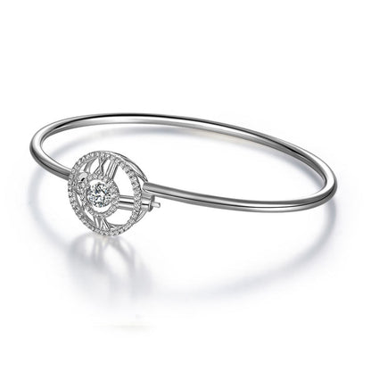 Pulsera brazalete con piedra danzante y reloj con números romanos