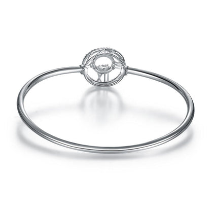 Pulsera brazalete con piedra danzante y reloj con números romanos