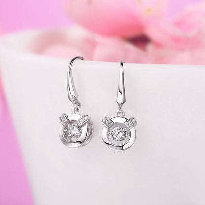 Boucles d'oreilles pendantes en pierre ronde dansante