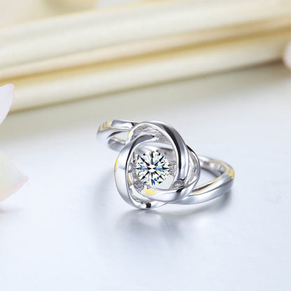 Anillo de piedra danzante con nudo de amor