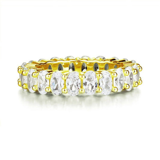 Anillo de eternidad con diamantes simulados de talla ovalada en oro amarillo y plata de ley.