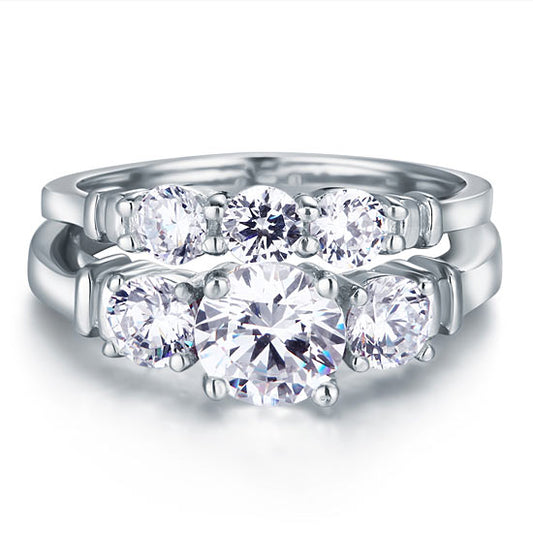 Conjunto nupcial de tres piedras con diamantes simulados en plata de ley