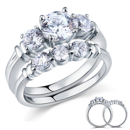 Conjunto nupcial de tres piedras con diamantes simulados en plata de ley