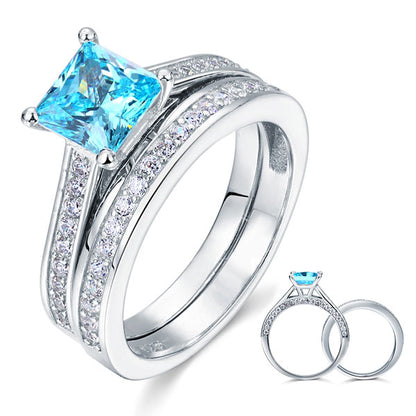 Conjunto nupcial de diamantes simulados azul agua de talla princesa de 1,5 quilates en plata de ley.