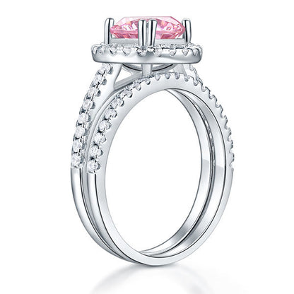 Conjunto nupcial de 2 quilates con halo redondo de diamantes simulados rosas en plata de ley
