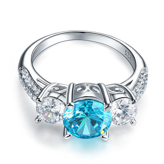 Anillo de diamantes simulados azul aguamarina de tres piedras de talla brillante redonda de 2 quilates