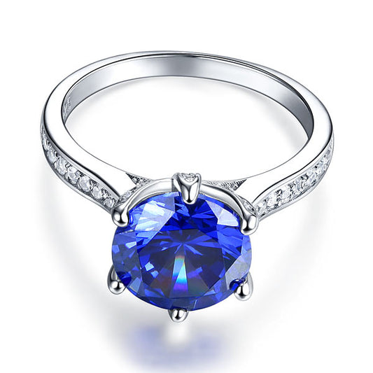 Anillo de tanzanita azul de talla brillante redonda de 3 quilates en plata de ley.