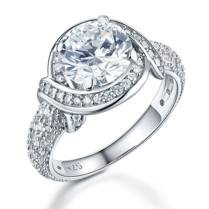 Anillo de estilo vintage con halo redondo y giro de 2 quilates en plata de ley