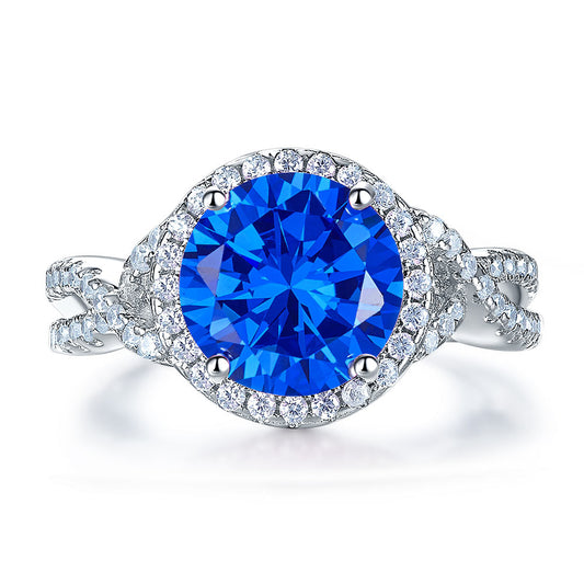 Anillo de 3 quilates con diamante azul simulado de talla brillante redonda y cuerpo retorcido en plata de ley.