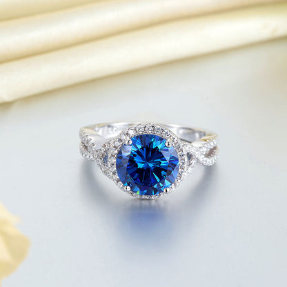 Anillo de 3 quilates con diamante azul simulado de talla brillante redonda y cuerpo retorcido en plata de ley.