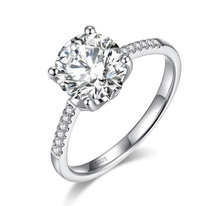 Anillo de compromiso de moissanita redonda de 2 quilates en plata de ley.