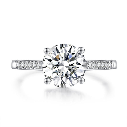 Anillo de compromiso de moissanita redonda de 2 quilates en plata de ley.
