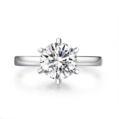 Anillo de compromiso de moissanita redonda de 2 quilates con halo de diamantes en plata de ley.