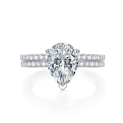Conjunto nupcial de moissanita de 2 quilates con corte de pera y diamantes en plata de ley.