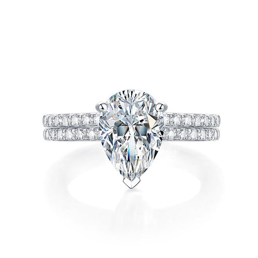 Conjunto nupcial de moissanita de 2 quilates con corte de pera y diamantes en plata de ley.