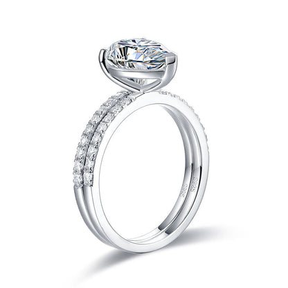 Conjunto nupcial de moissanita de 2 quilates con corte de pera y diamantes en plata de ley.