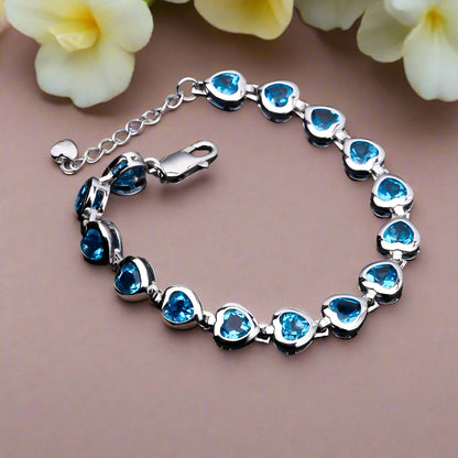 Pulsera GRACE con topacio azul suizo en forma de corazón en plata de ley