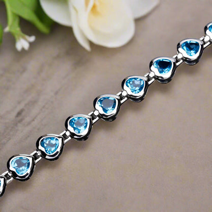 Pulsera GRACE con topacio azul suizo en forma de corazón en plata de ley