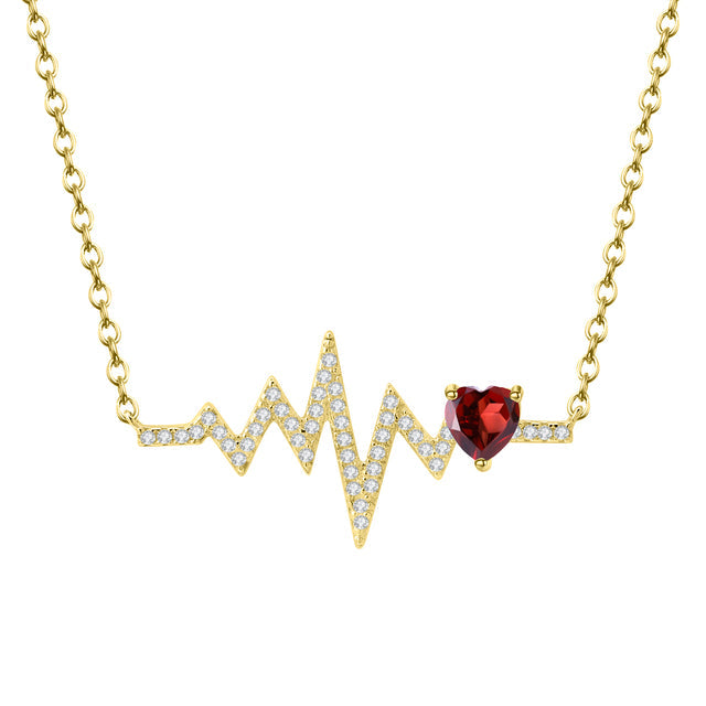 Collar GRACE con corazón de granate rojo y pulso en plata de ley bañada en oro